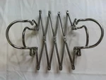 Stainless Steel Expandable Trivet Casserole Baking Dish Hot Pot Holder. Fixed Price $24.99.