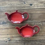 Le Creuset Cerise Cherry Red Bag Holder Of 2 Teapot Shape Stoneware Rest. Fixed Price $29.99.