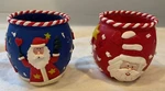 Set Two Funky Santa Claus Clay Coated Over Glass Candle Holders. Fixed Price $14.00.
