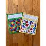 Set Of 2 Bright Colorful Puzzle Lover Pot Holders 7 X 8.5IN W Hang Tag. Fixed Price $18.99.