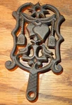 Old Primitive Vintage Small Cast Iron Metal Trivet #276 Star Birds Brooms Hearts. Fixed Price $14.95.
