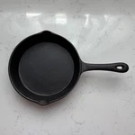 New 8" Cast Iron Skillet W/longer Handle, Lines For Better Grip, Cook Angle. Fixed Price $35.00.