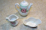 Set Greenbrier Resort Tea Pot Creamer Sugar Draper White Pink Flowers. Fixed Price $50.00.