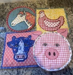 The Pioneer Woman 4 Pack Trivets, 100% Cotton Quilted Farm Animal. Fixed Price $24.99.