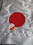 Le Creuset 8" Silicone Fernch Trivet Red. Fixed Price $24.99.