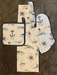 Now Designs Danica Compass Set: Apron, Oven Mitt And Pot Holder Cotton Seaside. Fixed Price $49.00.