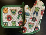 Now Designs Danica Explore More Oven Mitt And Pot Holder Set Green/ Multi. Fixed Price $25.99.