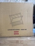 Casual Home Luggage Rack 26DOT75 In Wide With Shelf Honey Oak. Fixed Price $65.00.